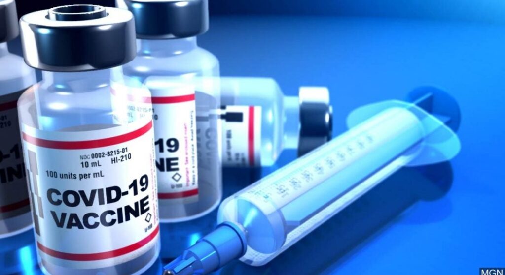 covid 19 vaccine generic blue background 1090x595.jpg